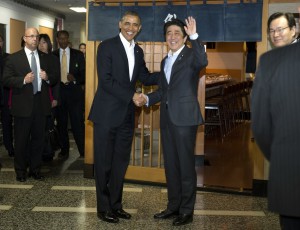 President Barack Obama and Japanese Prime Minister Shinzo Abe shake hands