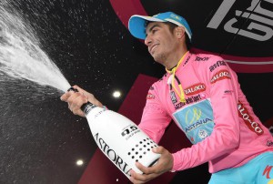 98th Giro d'Italia: The new overall leader, Fabio Aru of the Astana Pro team, wers the pink jersy on the podium of the 13th stage 