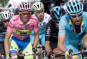 The overall leader Spanish rider Alberto Contador of the Tinkoff-Saxo team wears the pink jersey and  leads on italian rider Fabio Aru (R)