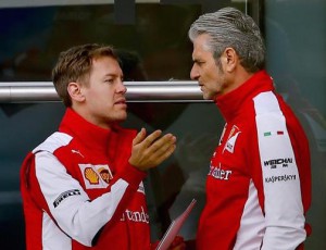 German Formula One driver Sebastian Vettel (L) of Scuderia Ferrari and Scuderia Ferrari Team Principal Maurizio Arrivabene