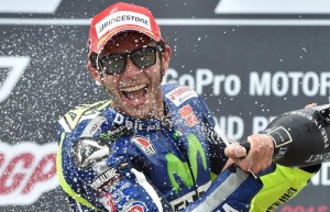 Third-placed Italian MotoGP rider Valentino Rossi of Movistar Yamaha MotoGP celebrates on the podium after the MotoGP race at the Motorcycle World Championship Grand Prix of Germany at the Sachsenring racing circuit in Hohenstein-Ernstthal, Germany, 12 July.  EPA/HENDRIK SCHMIDT