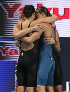 Italian team members embrace as they celebrate their second place finish in the women's 4x200m freestyle relay final at the Swimming World Championships in Kazan, Russia, Thursday, Aug. 6, 2015. (ANSA/AP Photo/Michael Sohn)