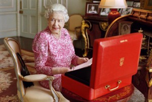 This photo made available on Tuesday Sept. 8, 2015, shows Britain's Queen Elizabeth II taken July 2015 and released by Buckingham Palace to mark the Queen becoming the longest reigning British monarch. The photograph, by Mary McCartney, shows The Queen seated at her desk in her private audience room at Buckingham Palace in London, with one of her official red boxes which she has received almost every day of her reign and contains important papers from government ministers in the United Kingdom and her Realms and from her representatives across the Commonwealth and beyond. (Mary McCartney/Queen Elizabeth II via AP) 