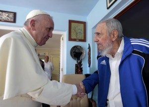Pope Francis and Cuba's Fidel Castro shakes hands, in Havana, Cuba, Sunday, Sept. 20, 2015. The Vatican described the 40-minute meeting at Castro's residence as informal and familial, with an exchange of books. (ANSA/AP Photo/Alex Castro)