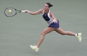 Flavia Pennetta of Italy hits a return to Samantha Stosur of Australia during their match on the eighth day of the 2015 EPA/JASON SZENES