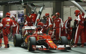 German Formula One driver Sebastian Vettel of Scuderia Ferrari in action after a pitstop during the Singapore Formula One Grand Prix night race in Singapore, 20 September 2015.  EPA/OLIVIA HARRIS / POOL