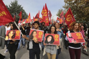 Protesters carrying pictures of people killed in Saturday's bombing attacks, walk during a march in Ankara, Turkey, Sunday, Oct. 11, 2015.  (ANSA/AP Photo/Burhan Ozbilici)