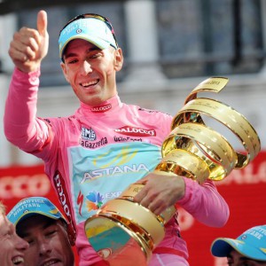 The winner of the 96th Giro d'Italia, Vincenzo Nibali of the Astana team, celebrates on the podium after the last stage from Riese Pio IX to Brescia , northern Italy, 2 6May 2013. ANSA/DANIEL DAL ZENNARO