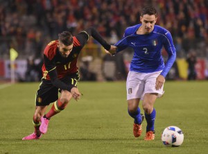 Belgium's Belgiums Yannick Carrasco, left,  right, fights for the ball with Italys Mattia De Sciglio during a friendly soccer match at the King Baudouin stadium in Brussels on Friday, Nov. 13, 2015. (ANSA/AP Photo/Geert Vanden Wijngaert)