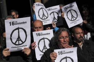 Members of some Spanish trade unions hold up banners that reads, ''November 16. We Are All  Paris'' as they stand during a minute of silence for the victims in Friday's attacks in Paris  in Pamplona, northern Spain, Monday, Nov. 16, 2015. (ANSA/AP Photo/Alvaro Barrientos)