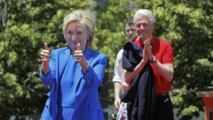 U.S. Democratic presidential candidate Hillary Clinton is joined onstage by her husband former President Bill Clinton after she delivered her "official launch speech" at a campaign kick off rally in Franklin D. Roosevelt Four Freedoms Park on Roosevelt Island in New York City, June 13, 2015. REUTERS/Carlo Allegri