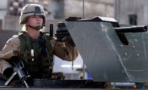 A female U.S. soldier mans her weapon ontop of a Humvee combat vehicle while on patrol in the streets of downtown Bagdad, Iraq, December, 2003. EPA PHOTO/EPA/KIM LUDBROOK  EPA/KIM LUDBROOK
