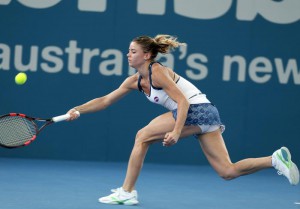 Camila Giorgi of Italy plays a shot in her first round match against Angelique Kerber of Germany during the Brisbane International tennis tournament in Brisbane, Australia, Monday, Jan. 4, 2016. (ANSA/AP Photo/Tertius Pickard)