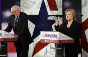 Hillary Rodham Clinton, right, makes a point as Bernie Sanders listens during a Democratic presidential primary debate, Saturday, Nov. 14, 2015, in Des Moines, Iowa. (ANSA/AP Photo/Charlie Neibergall)