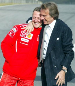 Il presidente della Ferrari Luca Cordero di Montezemolo abbraccia Michael Schumacher dopo la prova del la nuova 248 F1 che il prossimo anno correra'  il Mondiale di Formula 1. ANSA/MARCO BUCCO