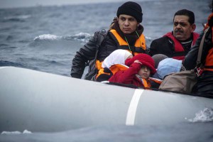 Refugees and migrants on a dinghy arrive from the Turkish coast to the northeastern Greek island of Lesbos, on Friday, Jan. 29, 2016.  (ANSA/AP Photo/Mstyslav Chernov)