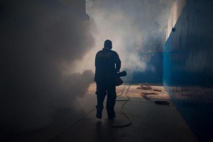 An employee of the muncipality of Chacao fumigates the hall of a school during efforts to prevent the possible spread of the Zika virus in the country, in Caracas, Venezuela, 05 February 2016.  ANSA/MIGUEL GUTIERREZ