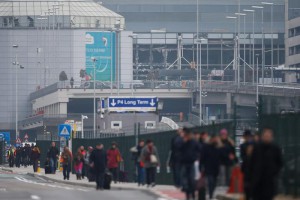 Passengers and airport staff are evacuated from the terminal building after explosions at Brussels Airport in Zaventem near Brussels, Belgium, 22 March 2016.  EPA/LAURENT DUBRULE