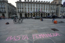 Alcune donne, rappresentanti del gruppo Non una di meno, scrivono con i gessetti colorati in piazza Castello i nomi delle donne assassinate per femminicidio dai loro compagni, Torino, 05 marzo 2021.